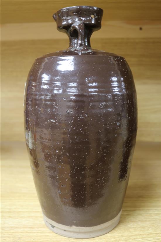 A Chinese late Ming brown glazed spouted jar